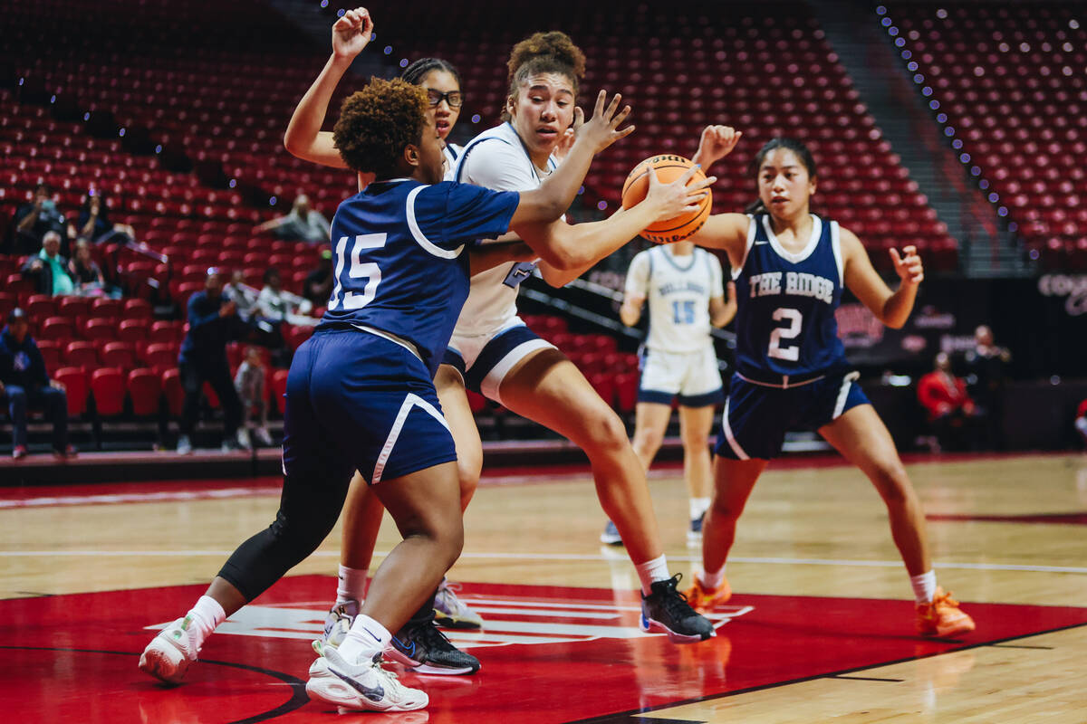 Centennial’s Nation Williams (24) keeps the ball from a Shadow Ridge defender during a Class ...