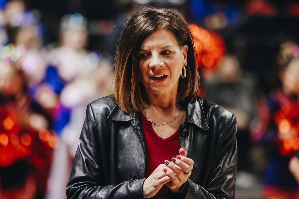 Bishop Gorman girls basketball head coach Sheryl Krmpotich claps during a Class 5A girls basket ...