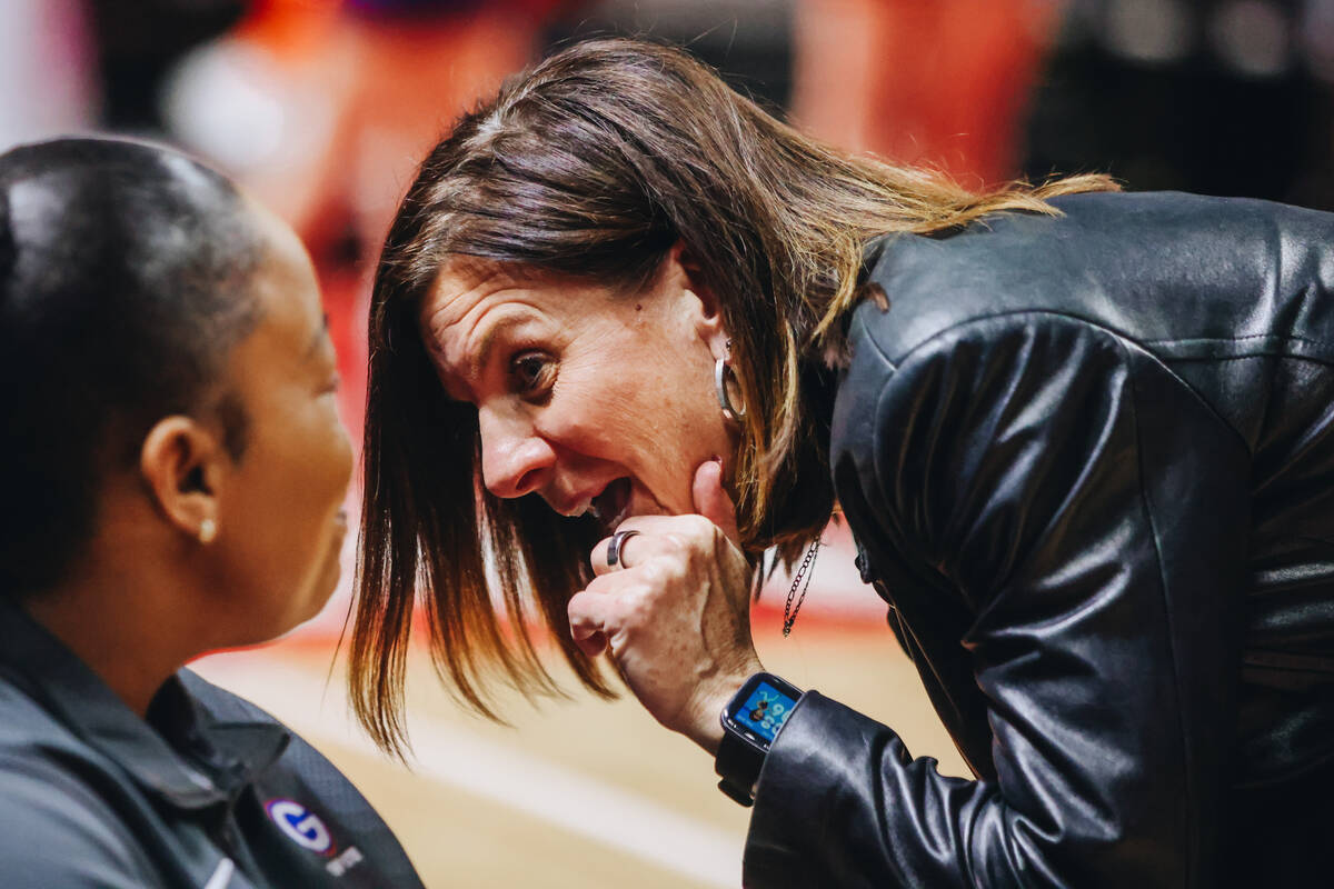Bishop Gorman girls basketball head coach Sheryl Krmpotich speaks to an assistant during a Clas ...