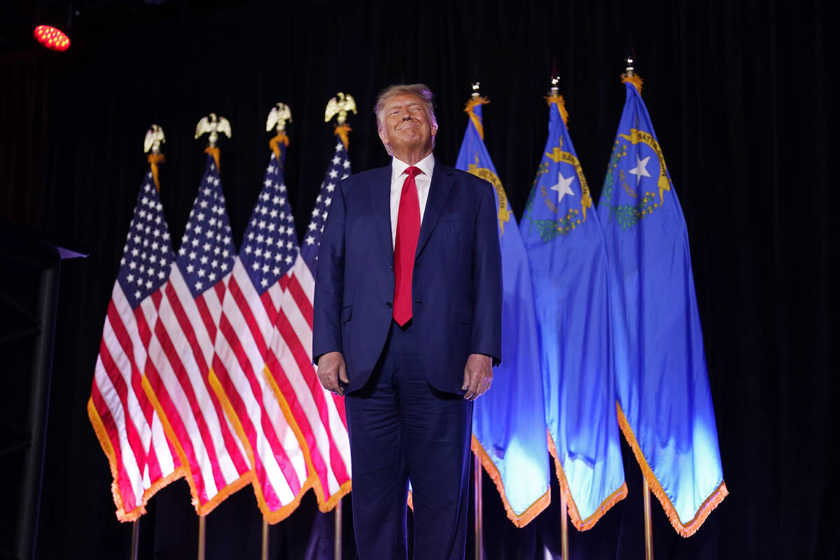 FILE - Former President Donald Trump stands on stage before speaking at a campaign event, July ...