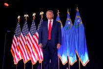 FILE - Former President Donald Trump stands on stage before speaking at a campaign event, July ...