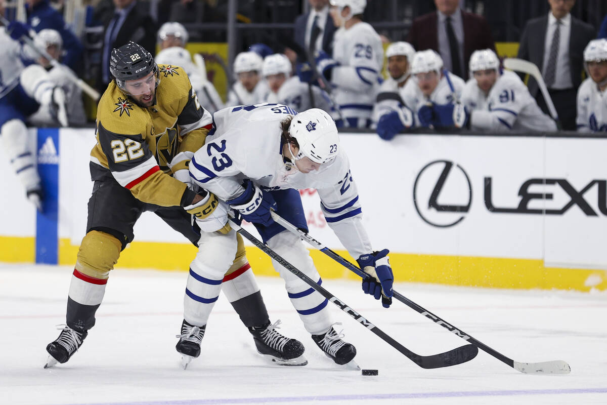 Vegas Golden Knights right wing Michael Amadio (22) attempts to steal the puck from Toronto Map ...