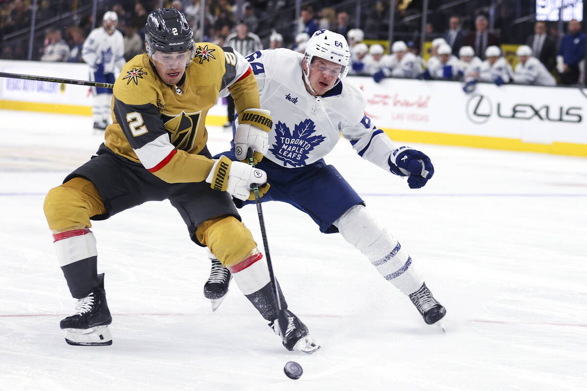 Vegas Golden Knights center Chandler Stephenson (20) skates past Toronto Maple Leafs center Dav ...