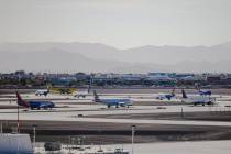 Planes wait in a line to take off on the tarmac at Harry Reid International Airport in Las Vega ...