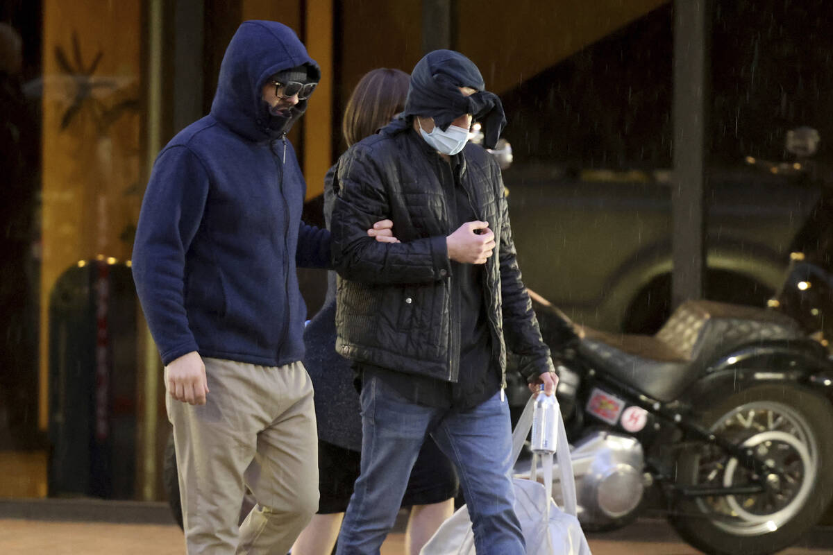 Former FBI informant Alexander Smirnov, left, walks out of his lawyer’s office in downto ...
