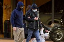 Former FBI informant Alexander Smirnov, left, walks out of his lawyer’s office in downto ...