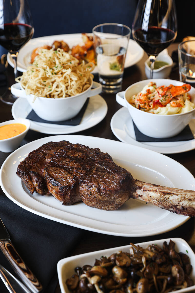 The ribeye logo tomahawk steak with a side of lobster mash potatoes and onion strings from Emmi ...