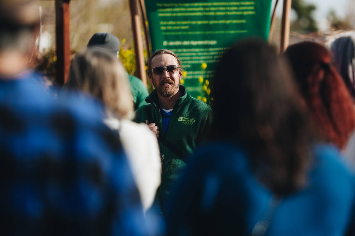 Ian Ford-Terry, an archaeologist at Springs Preserve speaks to a crowd in the Teaching Garden o ...