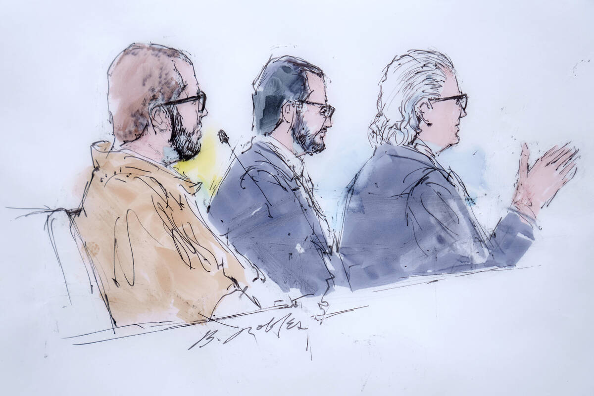 In this courtroom sketch defendant Alexander Smirnov, left, listens as his lawyer, David Chesno ...