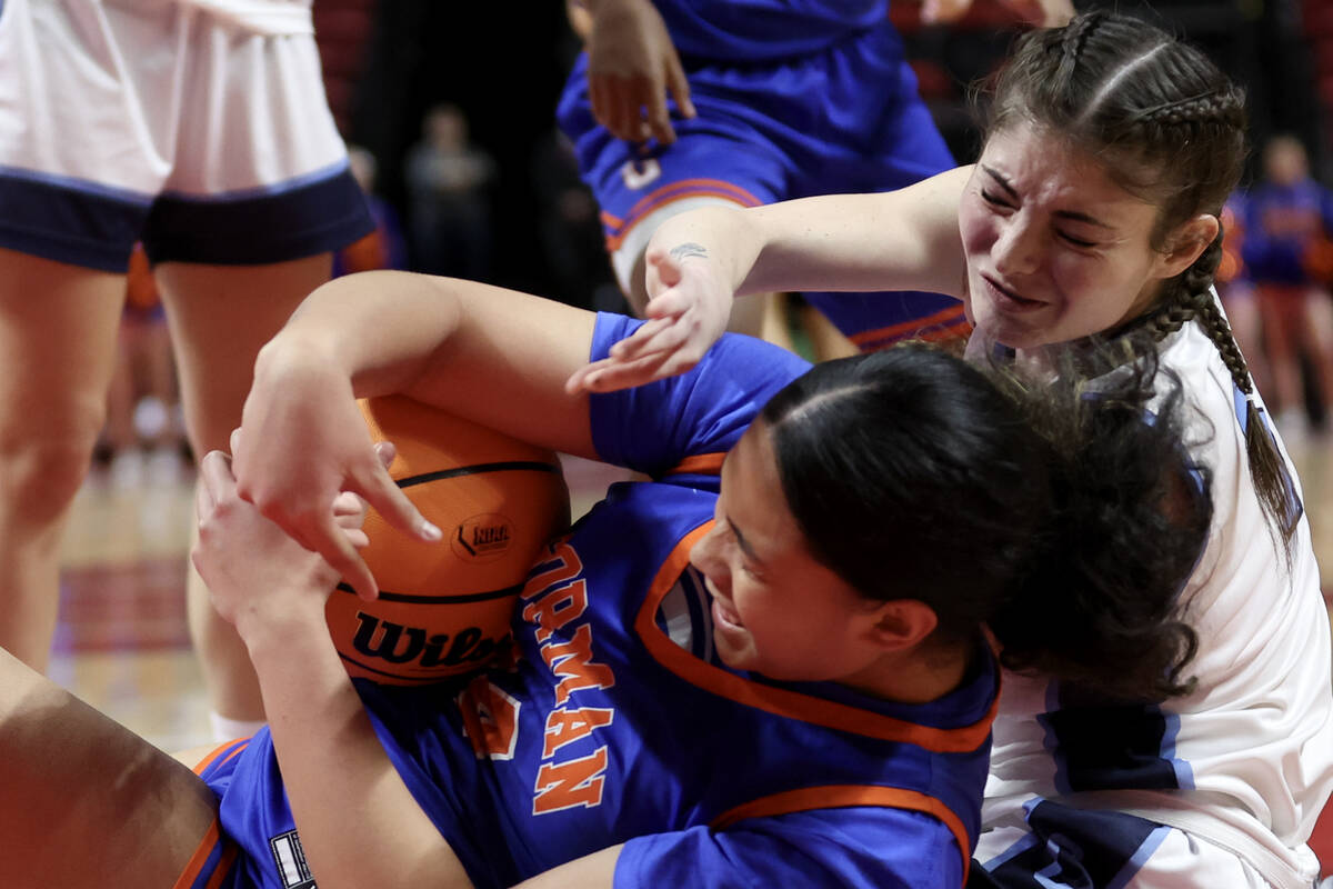 Bishop Gorman's Aliitasi Fakatoumafi (34) struggles for the ball against Centennial's Trysta Ba ...