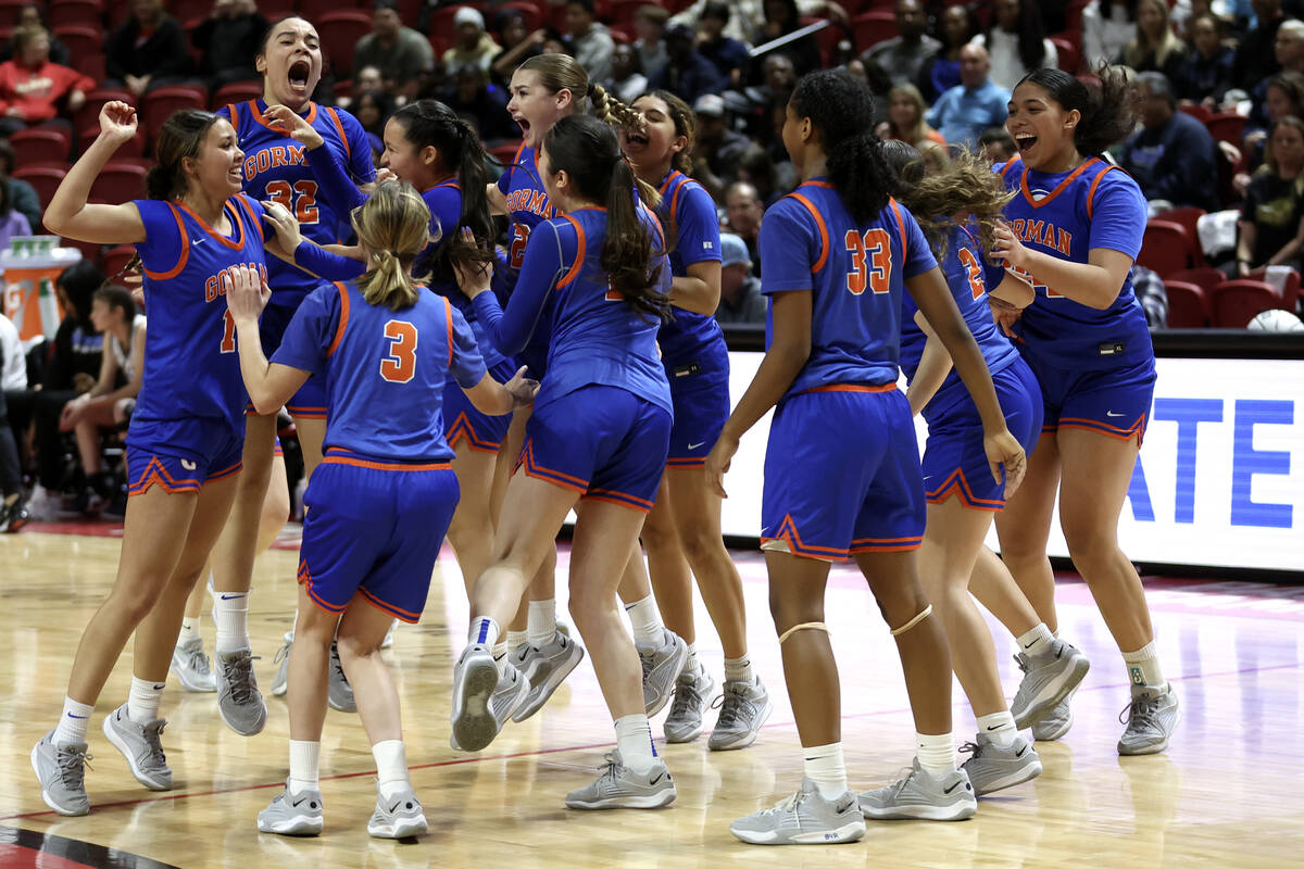 Bishop Gorman erupts in celebrations as they closely win the Class 5A girls basketball state ch ...