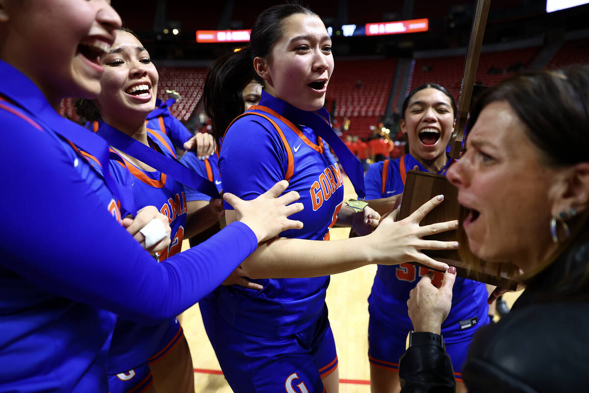 Bishop Gorman goes wild as head coach Sheryl Krmpotich hands them their Class 5A girls basketba ...