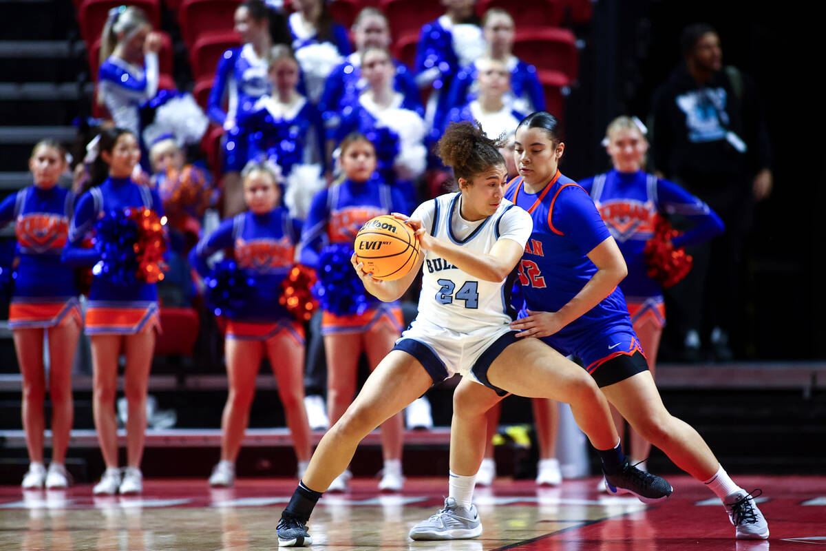 Centennial's Nation Williams (24) muscles toward the hoop against Bishop Gorman's Savannah Sear ...