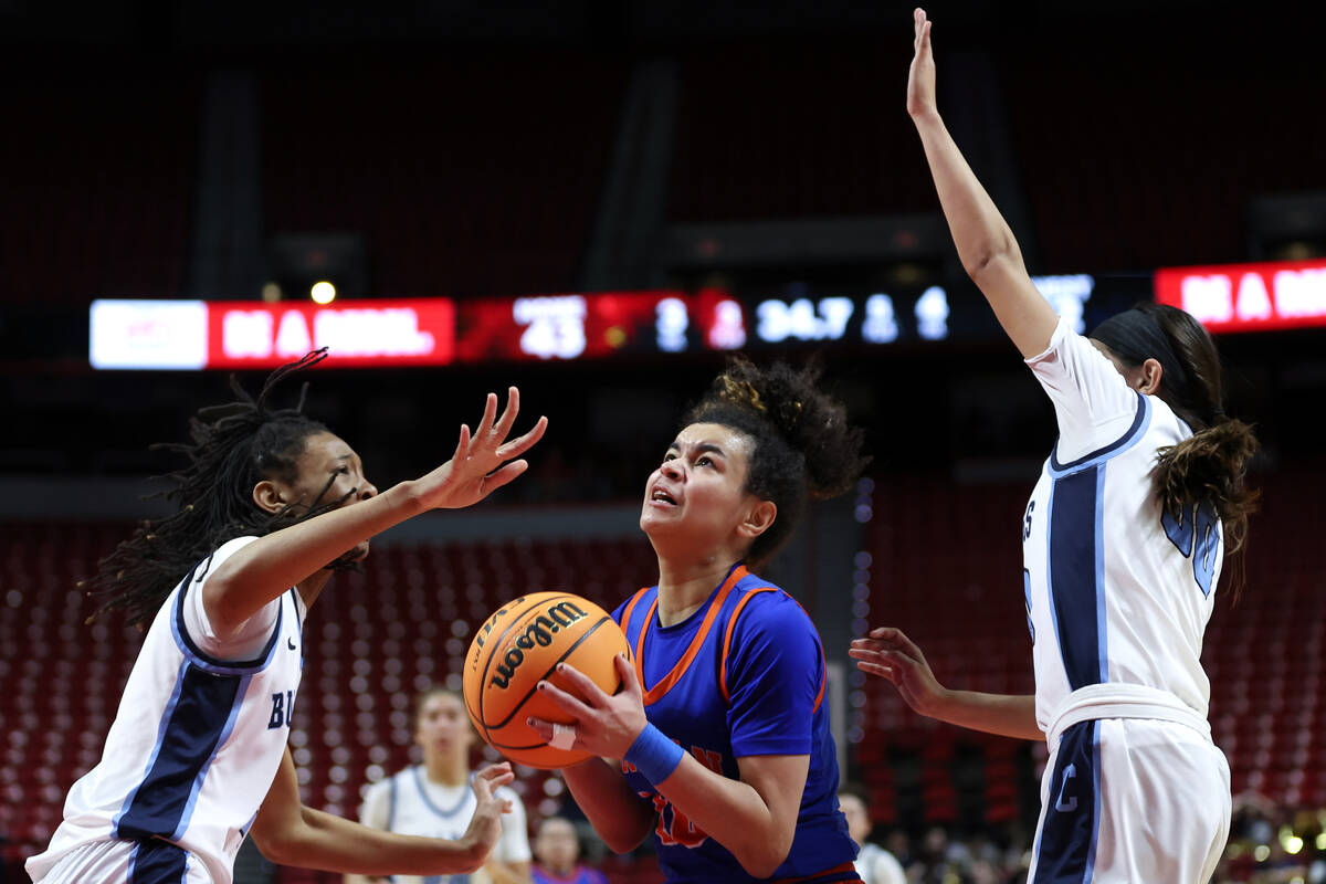Bishop Gorman's Aaliah Spaight (10) shoots between Centennial's Cici Ajomale (21) and Bella Cra ...