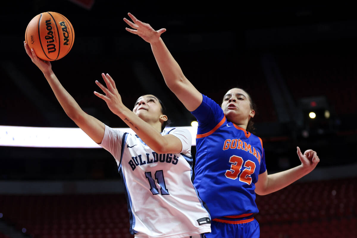 Centennial's Danae Powell (11) shoots against Bishop Gorman's Savannah Searcy (32) during the s ...