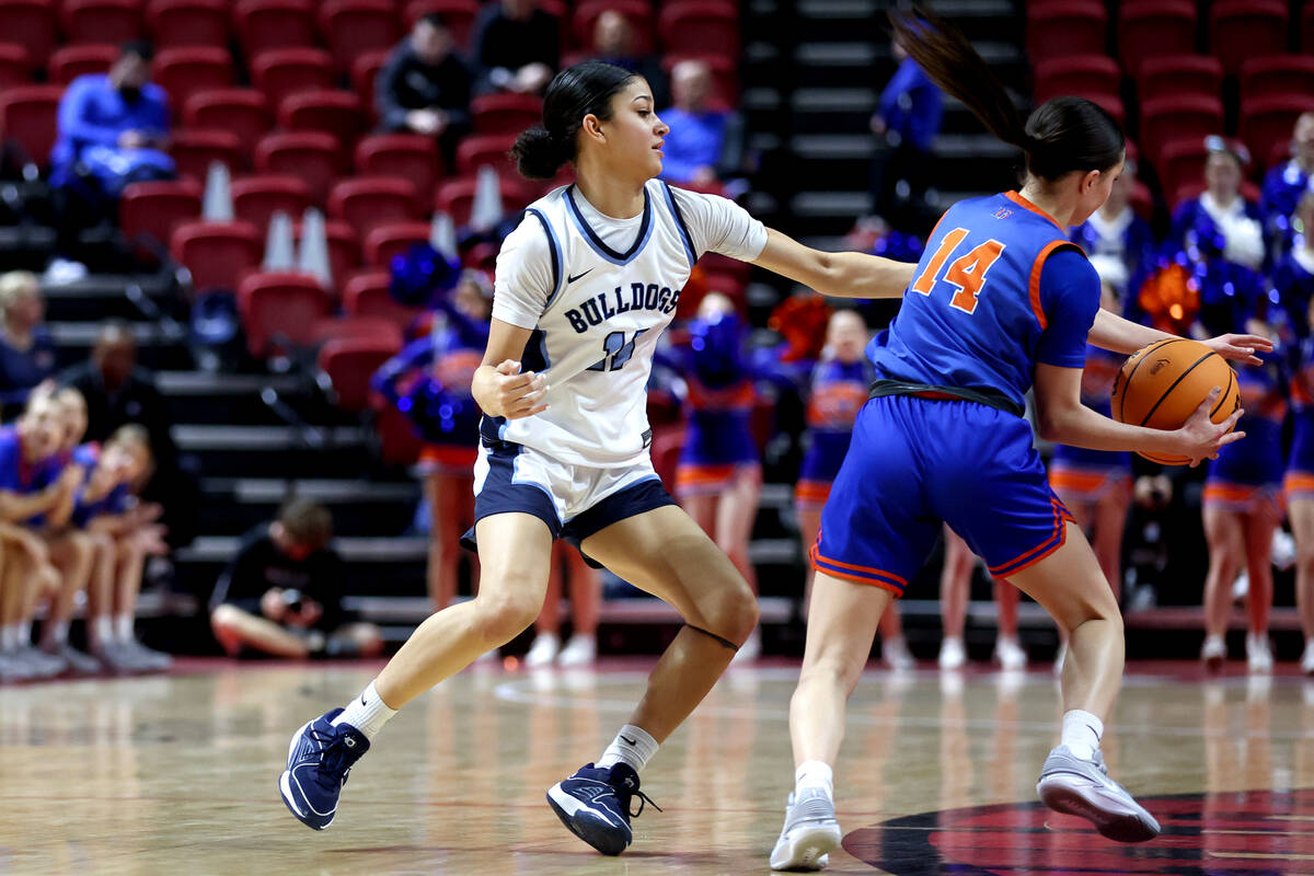 Bishop Gorman's Kenzee Holton (14) steals the ball from Centennial's Danae Powell (11) during t ...