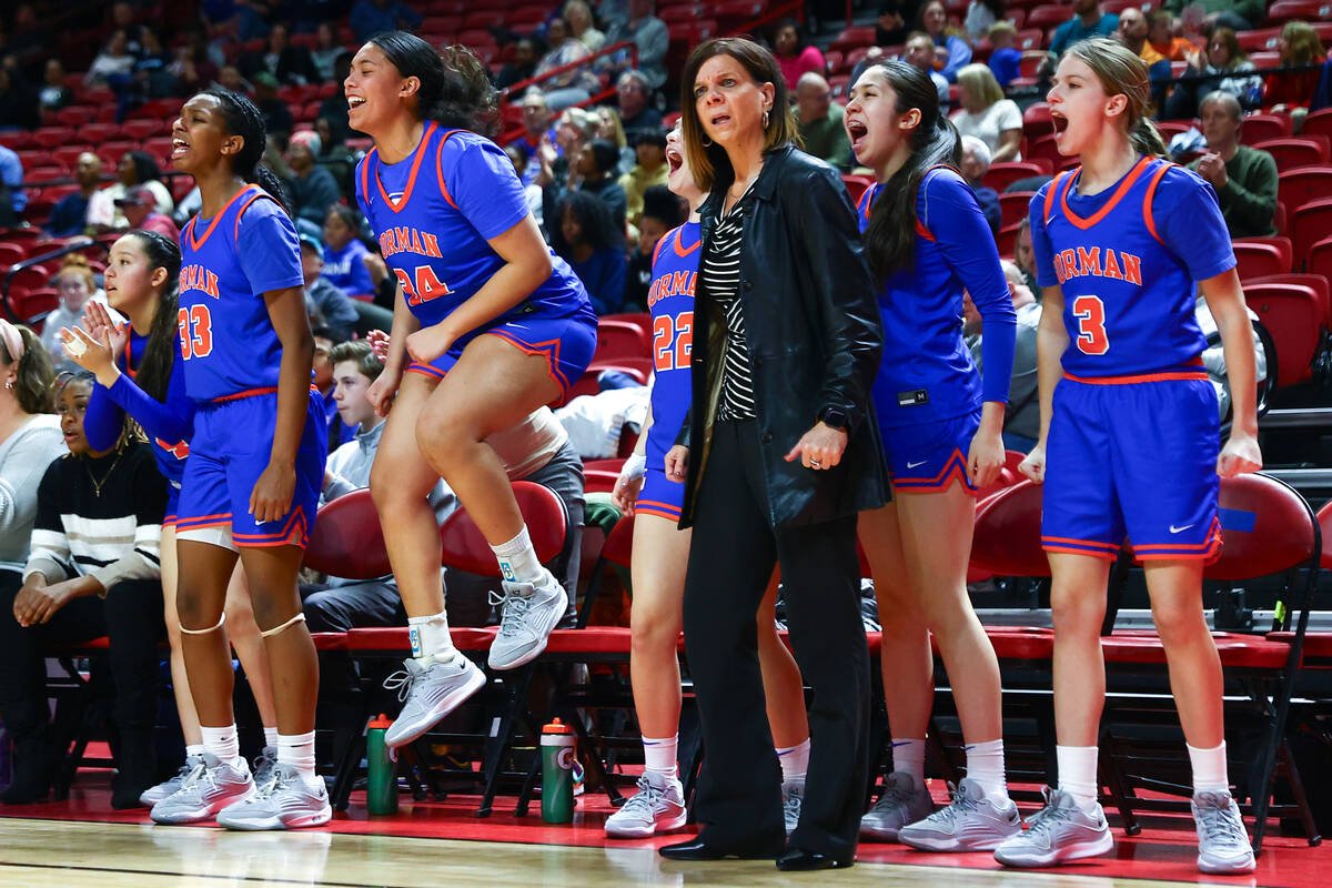 The Bishop Gorman bench and head coach Sheryl Krmpotich celebrate after a score during the seco ...