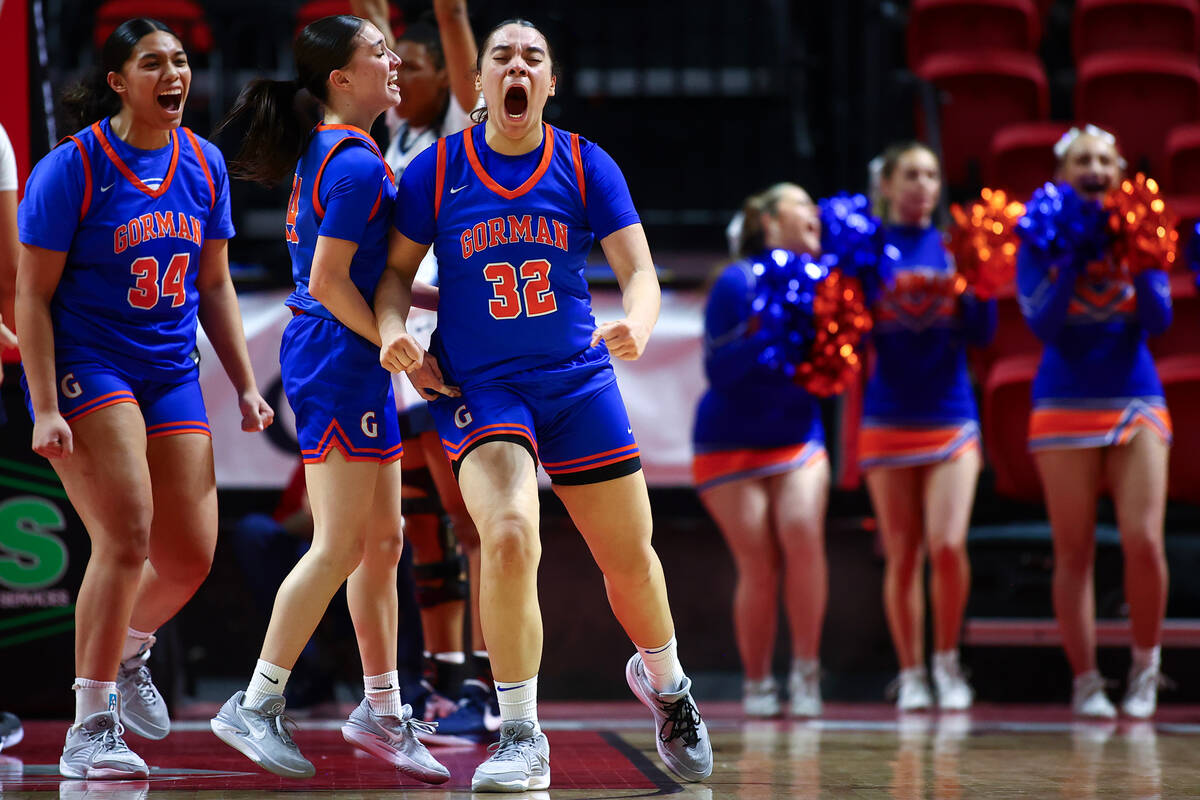 Bishop Gorman's Savannah Searcy (32) goes wild with her teammates after scoring and drawing a f ...