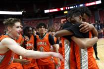 Bishop Gorman's Nick Jefferson, right, embraces Kameron Cooper after they won the Class 5A boys ...