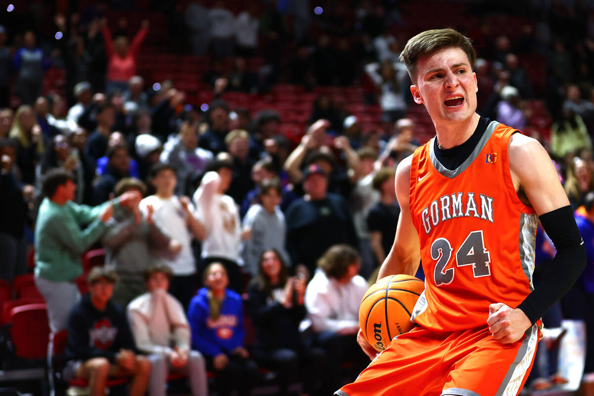 Bishop Gorman's Ryder Elisaldez (24) celebrates before shooting a game-securing free throw duri ...