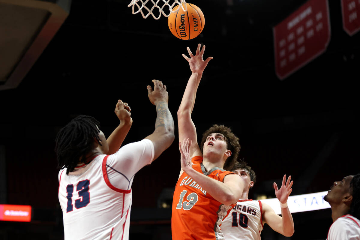 Bishop Gorman's Noah Westbrook (13) shoots against Coronado's Tee Bartlett (13) during the seco ...