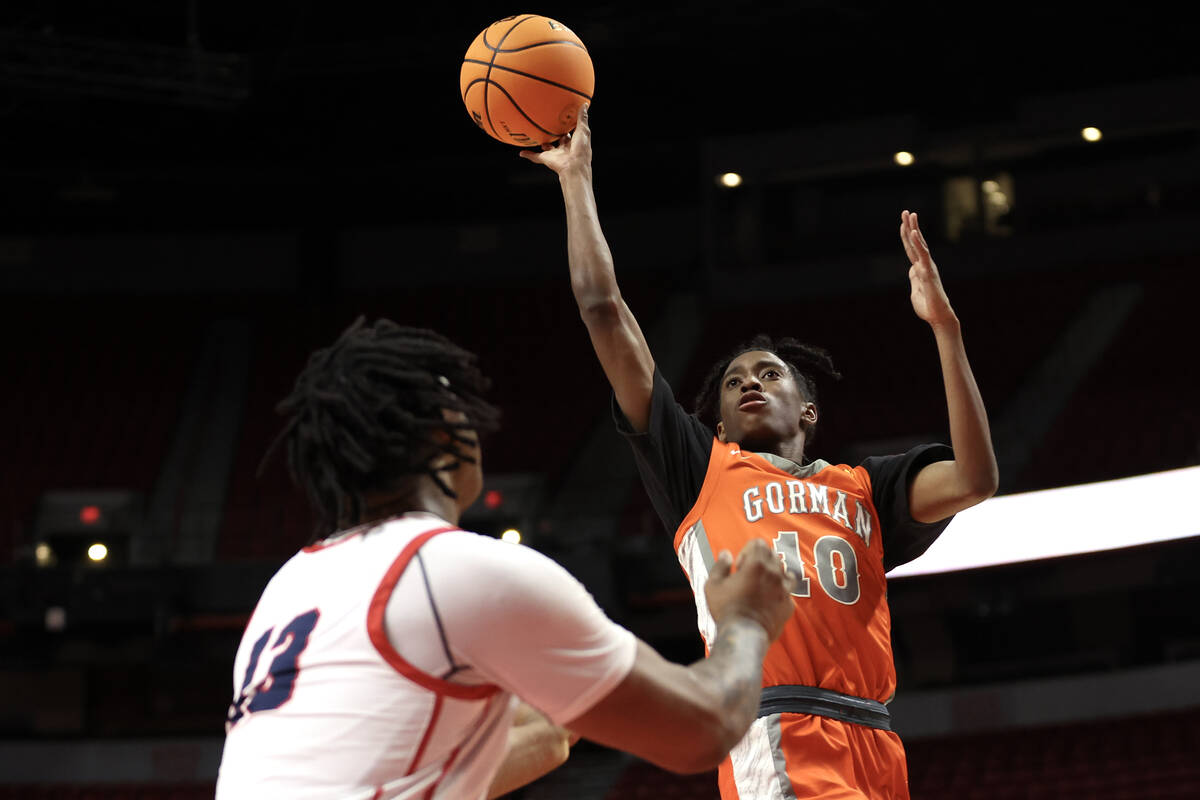 Bishop Gorman's Nick Jefferson (10) shoots against Coronado's Tee Bartlett (13) during the firs ...