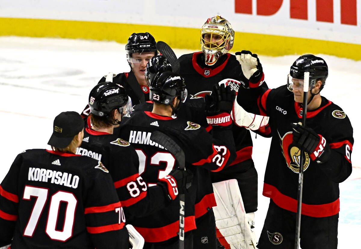 Ottawa Senators goaltender Anton Forsberg and teammates celebrate a shootout win against the Ve ...
