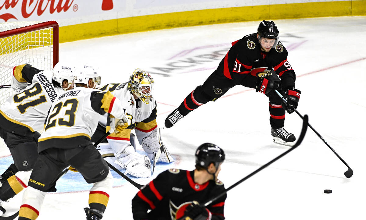 Ottawa Senators right wing Vladimir Tarasenko (91) tries to control the puck to get a shot on V ...