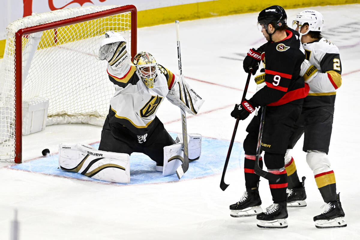 Ottawa Senators centre Josh Norris (9) scores on Vegas Golden Knights goaltender Logan Thompson ...