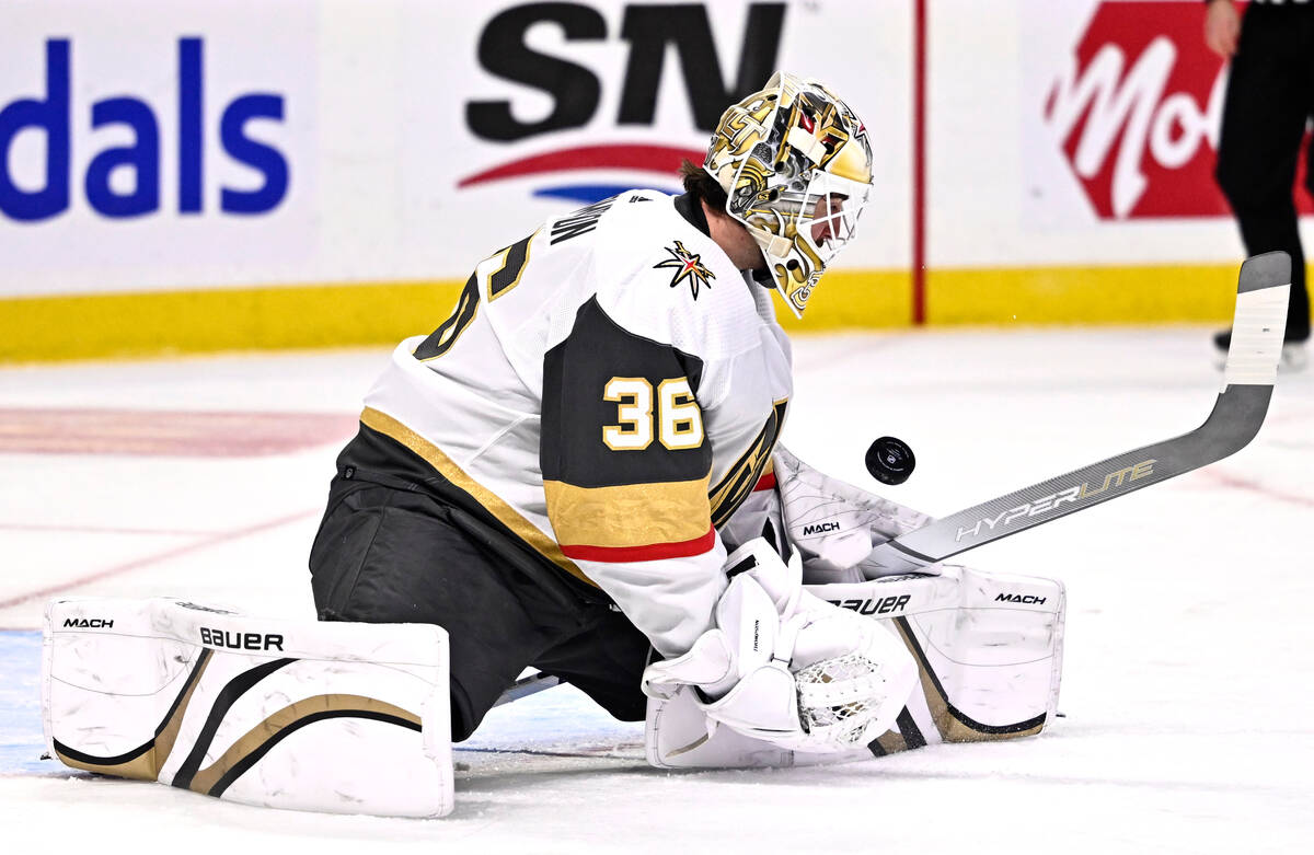 Vegas Golden Knights goaltender Logan Thompson watches the bouncing puck during the second peri ...