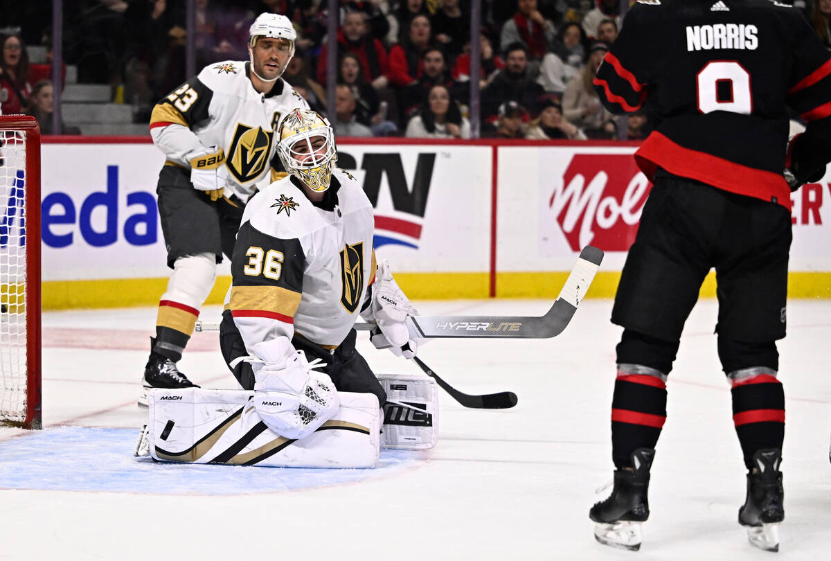 Vegas Golden Knights goaltender Logan Thompson (36) reacts as the puck bounces out of the net a ...