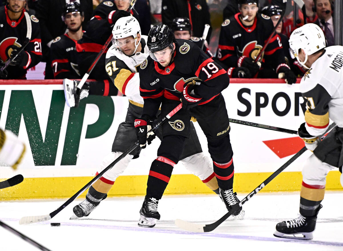 Ottawa Senators right wing Drake Batherson (19) works to keep the puck inside the blue line in ...