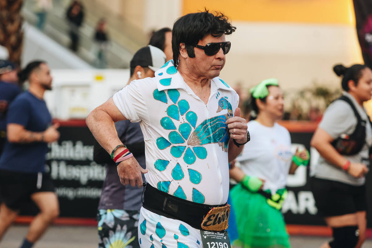 A runner dressed like Elvis takes to the Strip during the Rock ’n’ Roll Running S ...