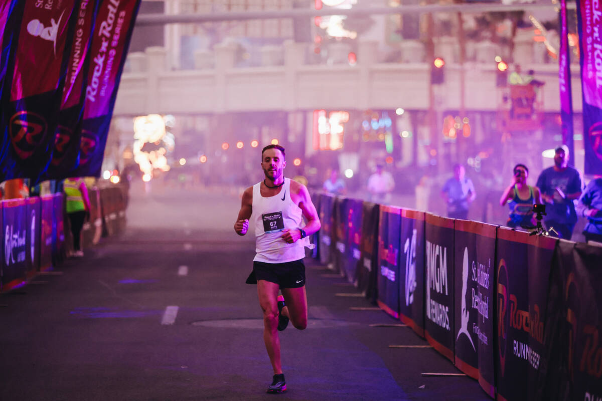 A runner finishes their run during the Rock ’n’ Roll Running Series on Las Vegas ...