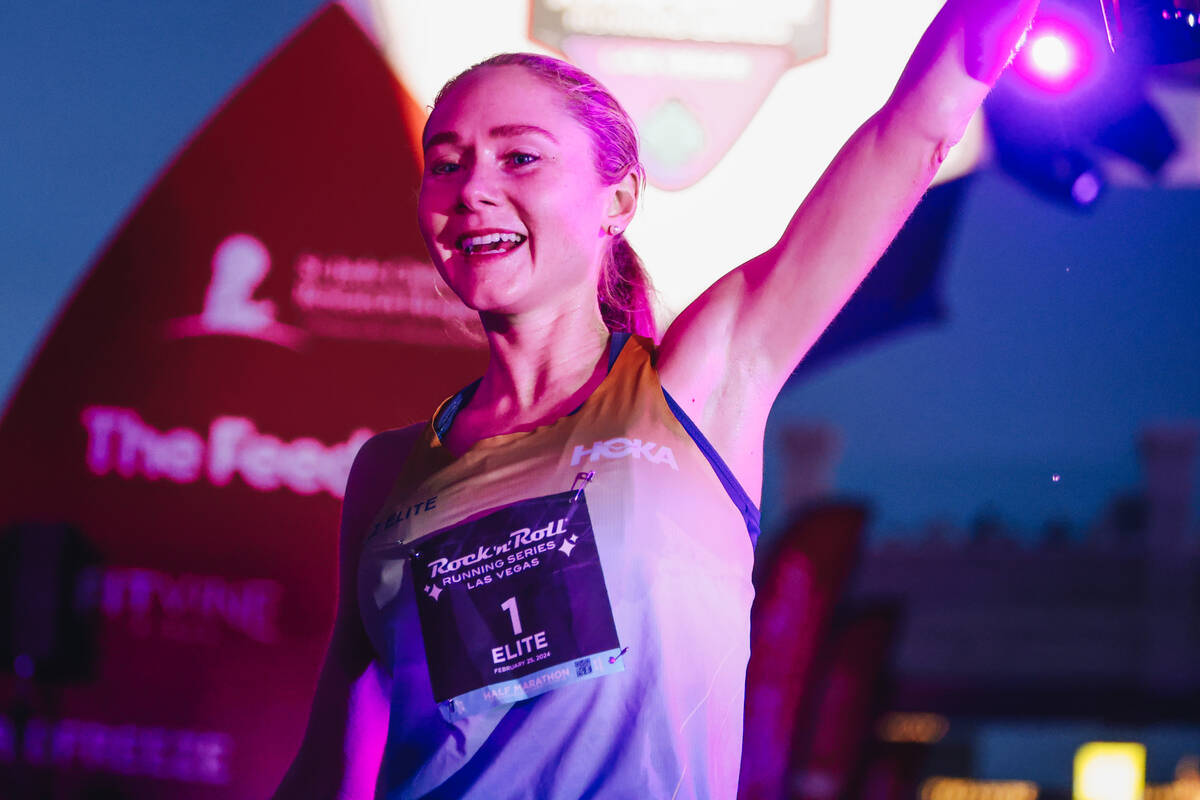 Alice Wright celebrates after coming in first for the women’s half marathon during the R ...