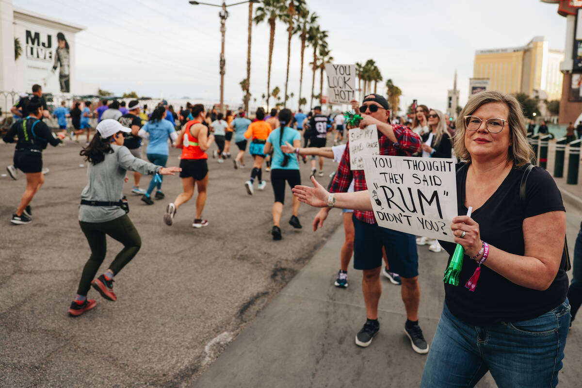 Supporters put their hands out for high fives from runners during the Rock ’n’ Ro ...