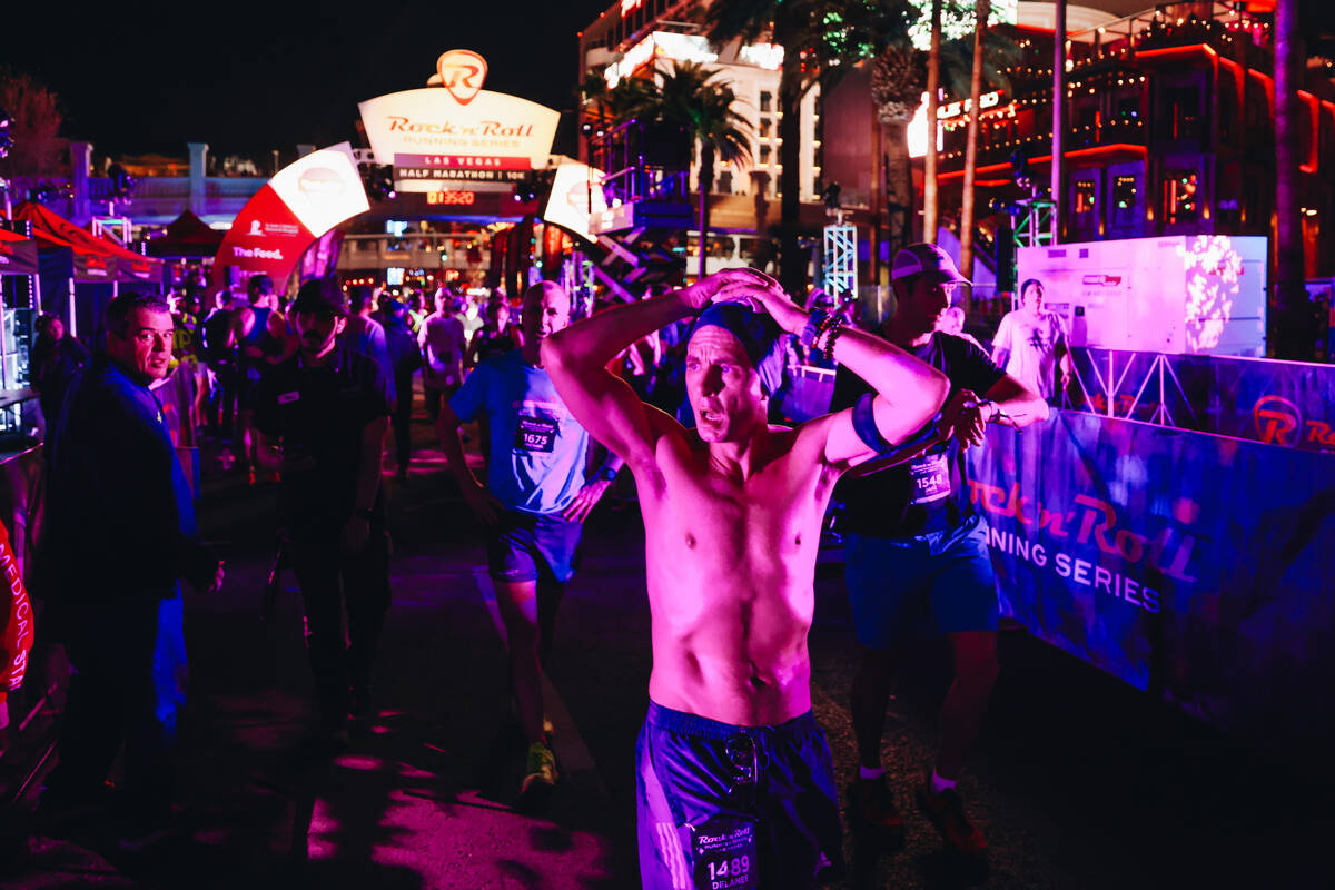 A runner catches their breath after finishing their run during the Rock ’n’ Roll ...