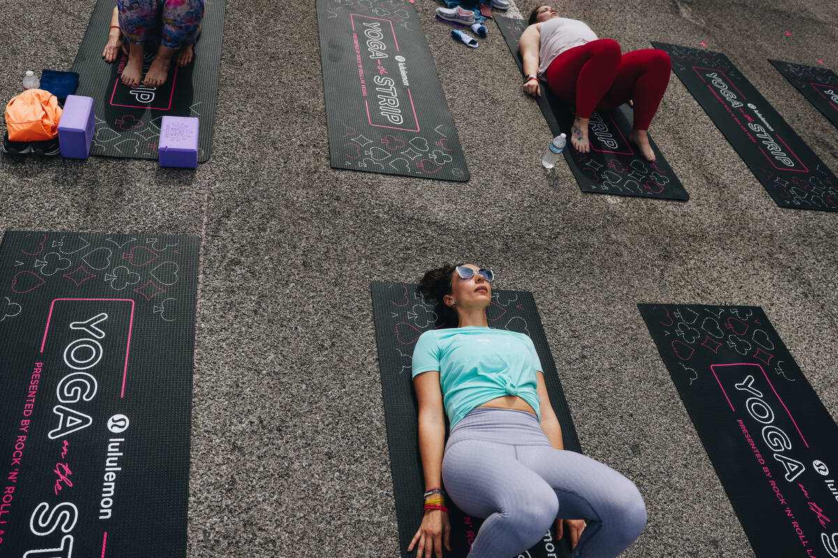 People gather on the Strip to do yoga while it is shut down for the Rock ’n’ Roll ...