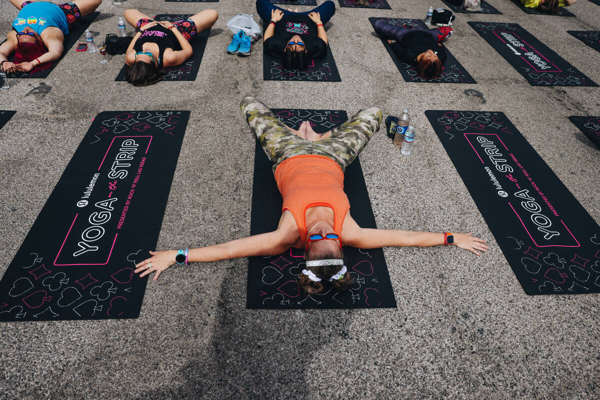 People gather on the Strip to do yoga while it is shut down for the Rock ’n’ Roll ...