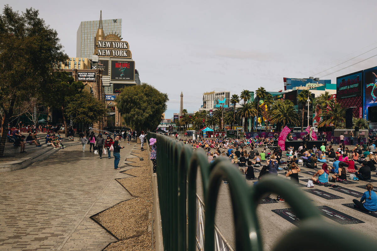 People gather on the Strip to do yoga while it is shut down for the Rock ’n’ Roll ...
