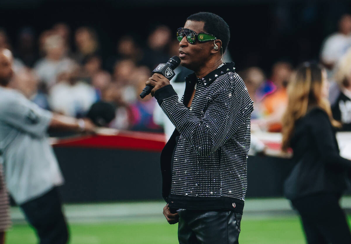 Babyface sings the national anthem before a game between the Raiders and New York Giants at All ...