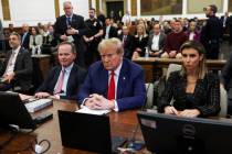 FILE - Former U.S. President Donald Trump, with lawyers Christopher Kise and Alina Habba, atten ...