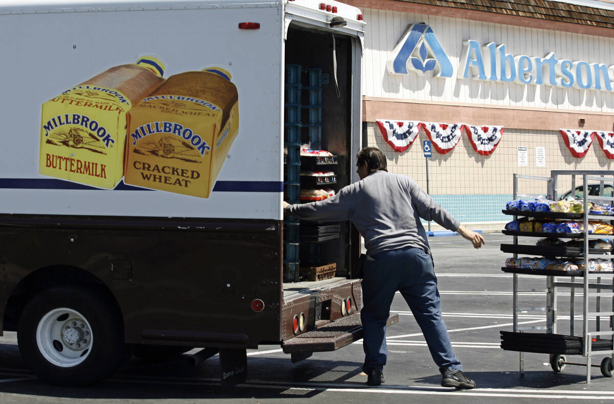 FILE - Mitch Maddox, a bread route salesman, loads bread Tuesday, May 30, 2006, outside the Eag ...