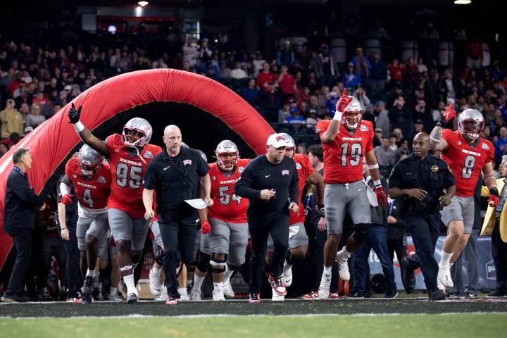 UNLV Rebels takes the field for the Guaranteed Rate Bowl NCAA college football game against the ...