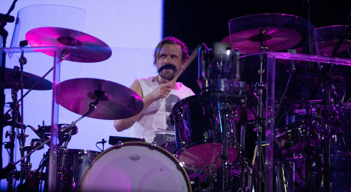 U2's fill-in drummer, Bram van den Berg (fake mustache), is shown at the Sphere on Feb.18, 2024 ...