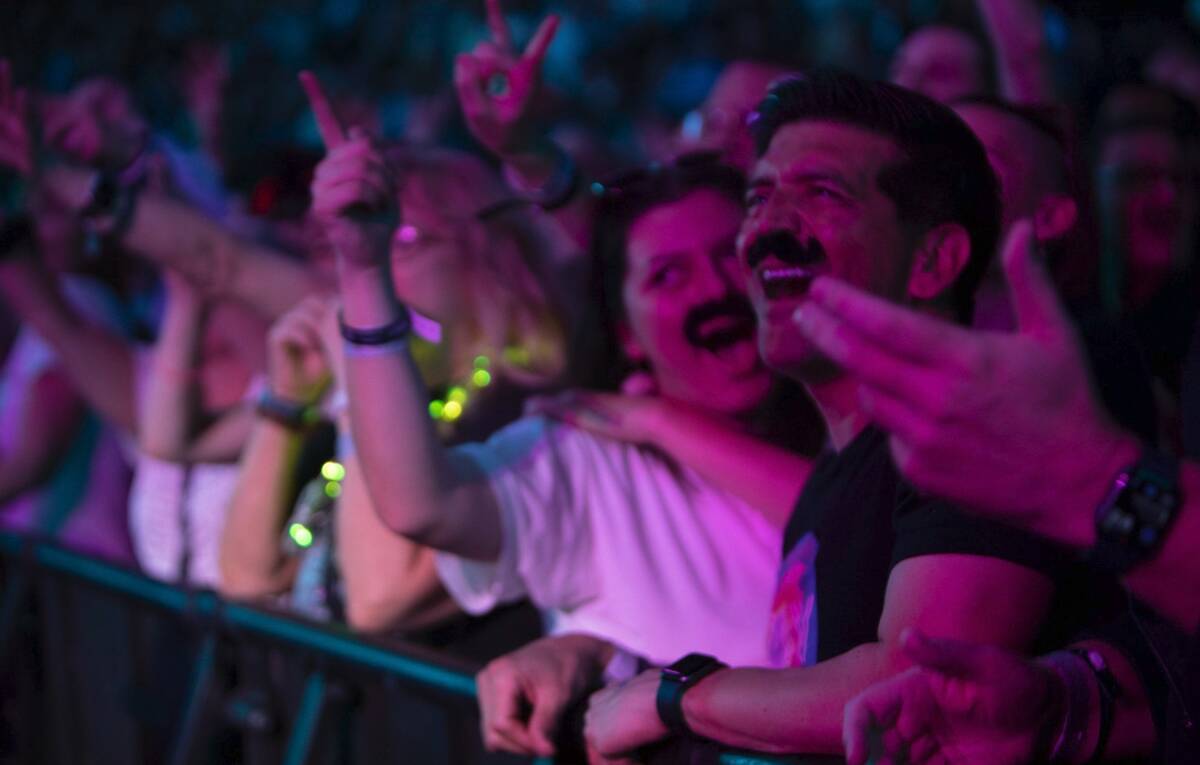 Fans with fake mustaches honor U2 bassist Adam Clayton at the Sphere on Feb.18, 2024. (Ross And ...