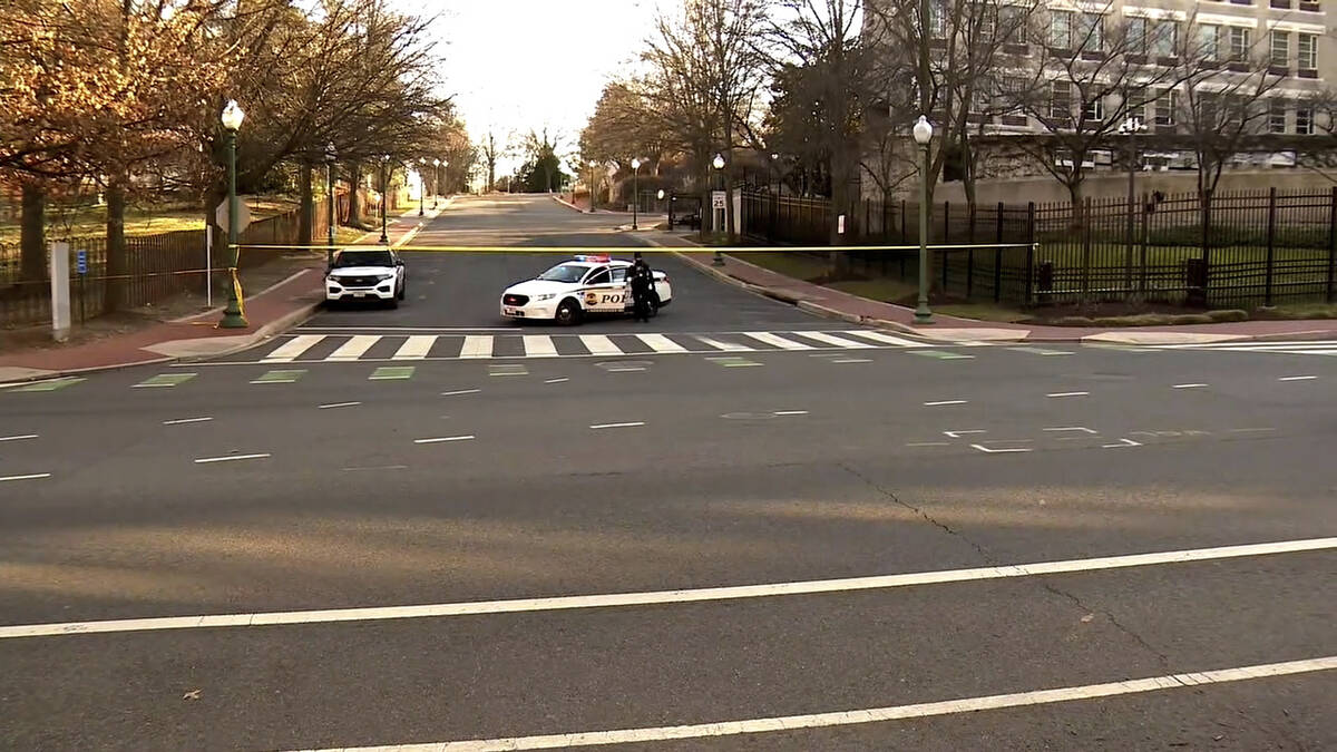 In this image taken from video, police are deployed outside the Israeli Embassy in Washington, ...