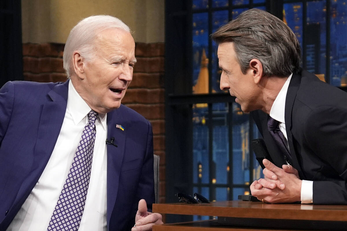 President Joe Biden talks with Seth Meyers during a taping of the "Late Night with Seth Me ...