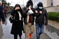 Alexander Smirnov, center, a confidential human source with the FBI, leaves the Lloyd George U. ...