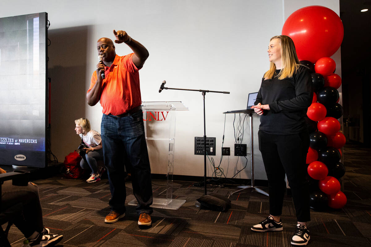 UNLV athletic director Erick Harper speaks alongside UNLV Lady Rebels head coach Lindy La Rocqu ...